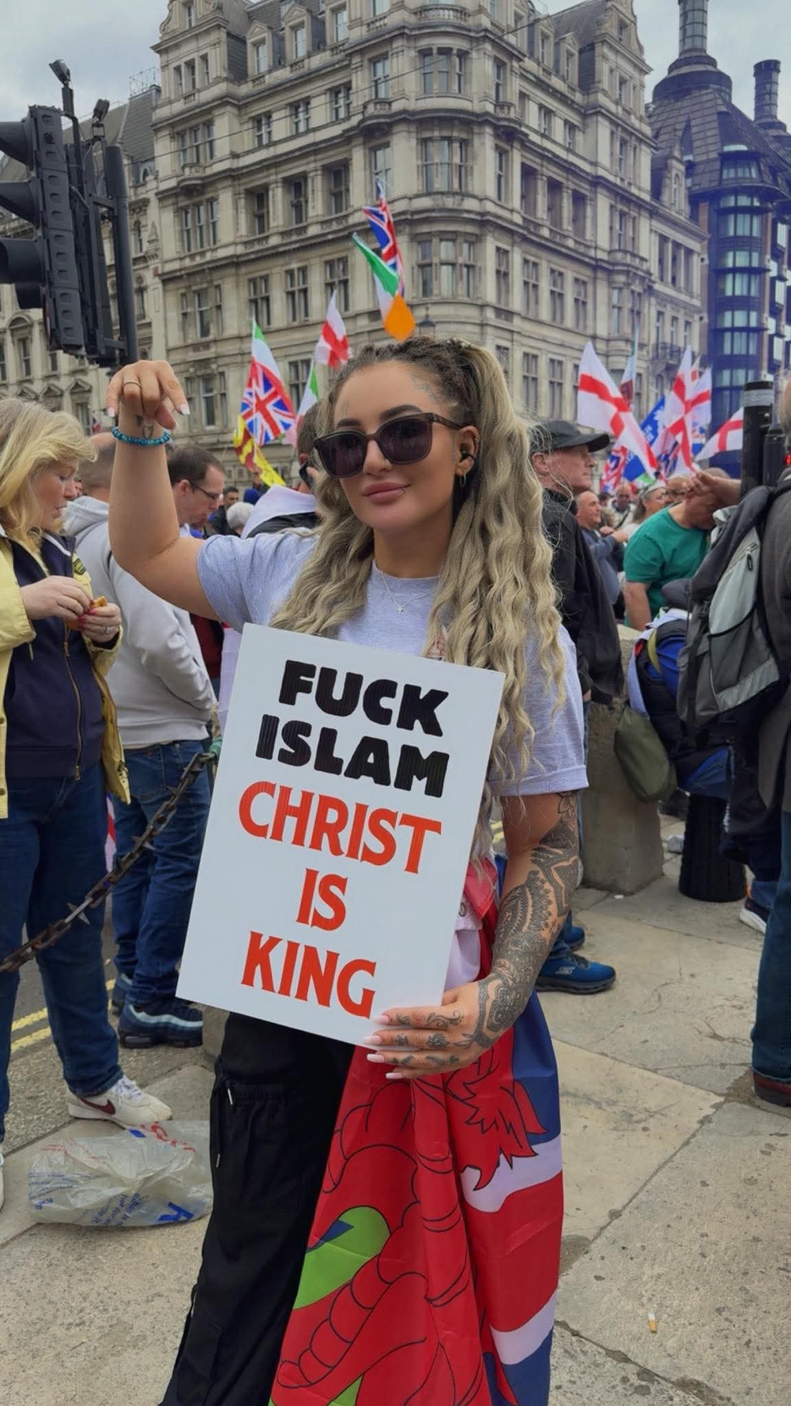 Placard displayed at the Unite the Kingdom rally reading 'FUCK ISLAM' above 'CHRIST IS KING'.